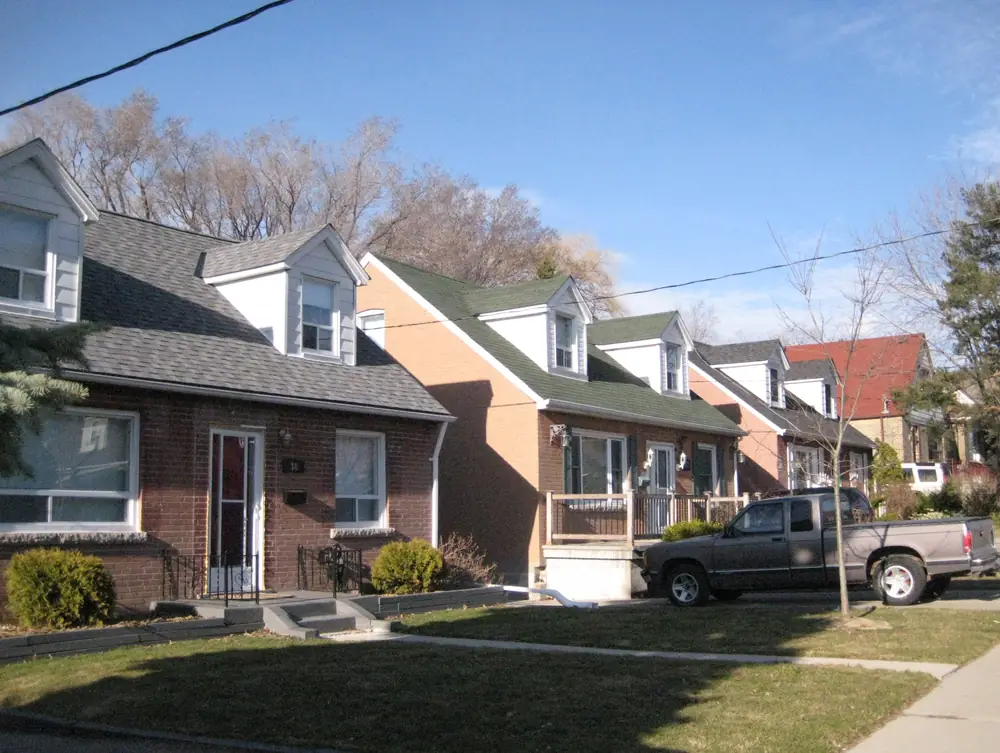 Brick storey-and-a-half houses with front lawns and dormer windows in O’Connor–Parkview, East York, Toronto