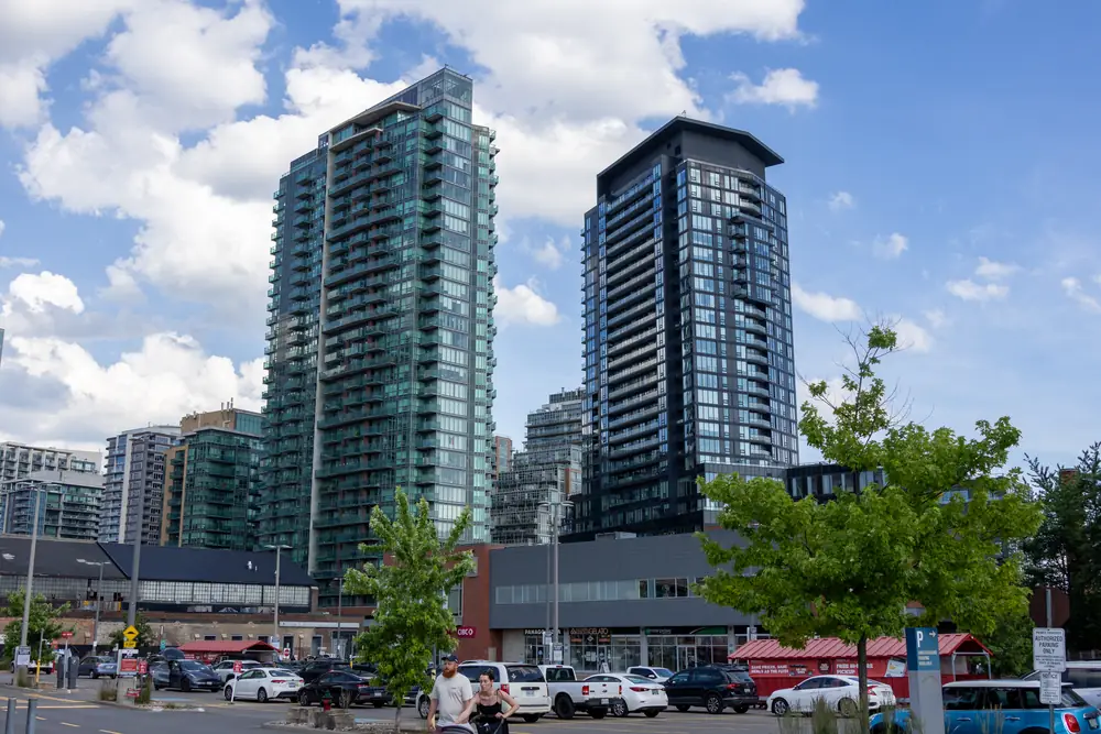 Two glass condo towers above the low-rise streets of Liberty Village, Toronto