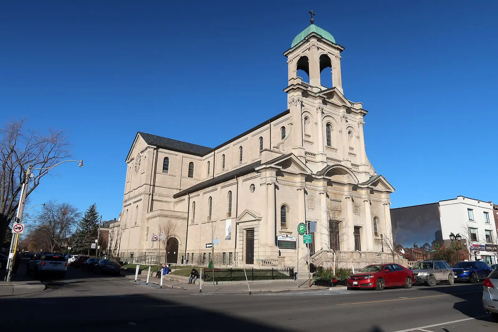 The Church of the Holy Name under a clear blue sky on Danforth Avenue near Pape, Toronto