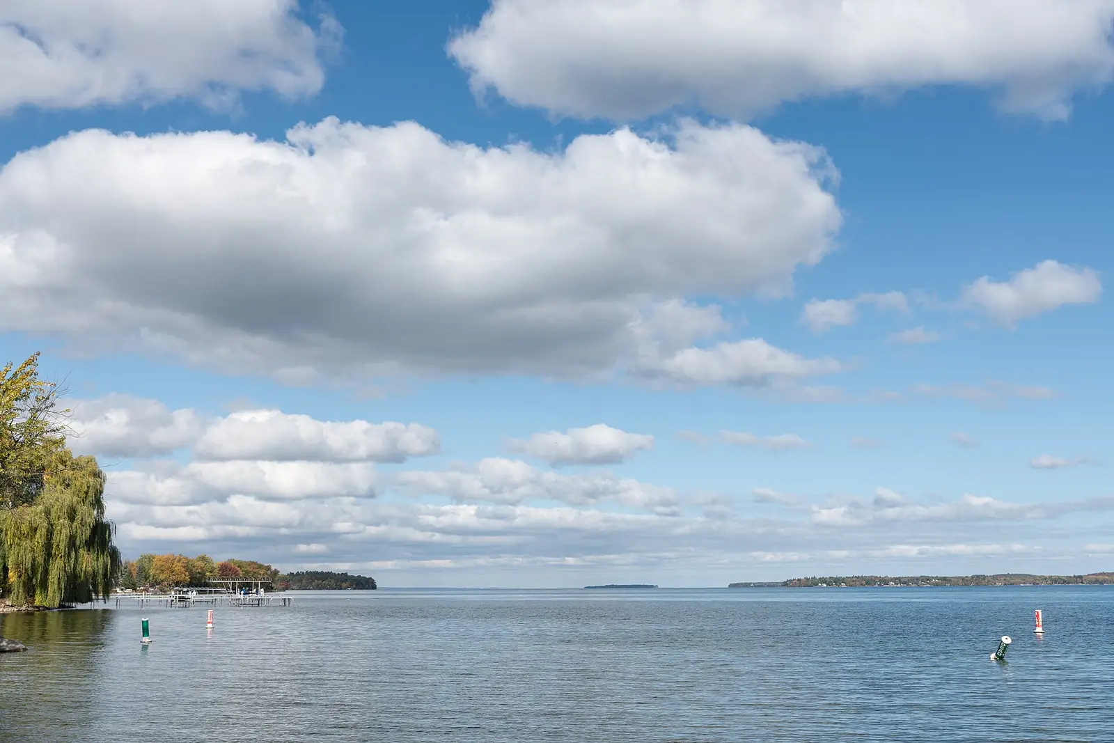 Cook’s Bay on Lake Simcoe seen from the shore at Gilford, Innisfil, under a blue sky
