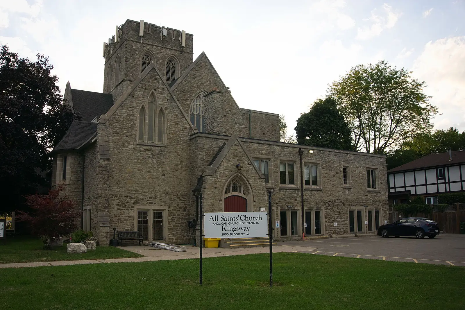 The stone All Saints’ Kingsway Anglican Church and its lawn on Bloor Street West, The Kingsway, Toronto