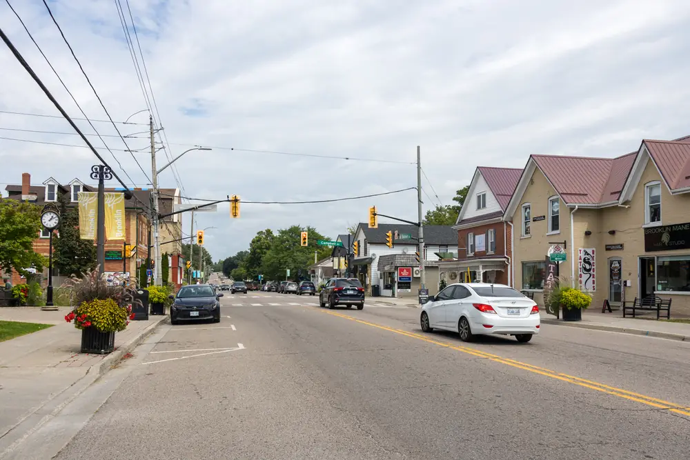 Looking north along Baldwin Street in Brooklin, Whitby, with shops and houses