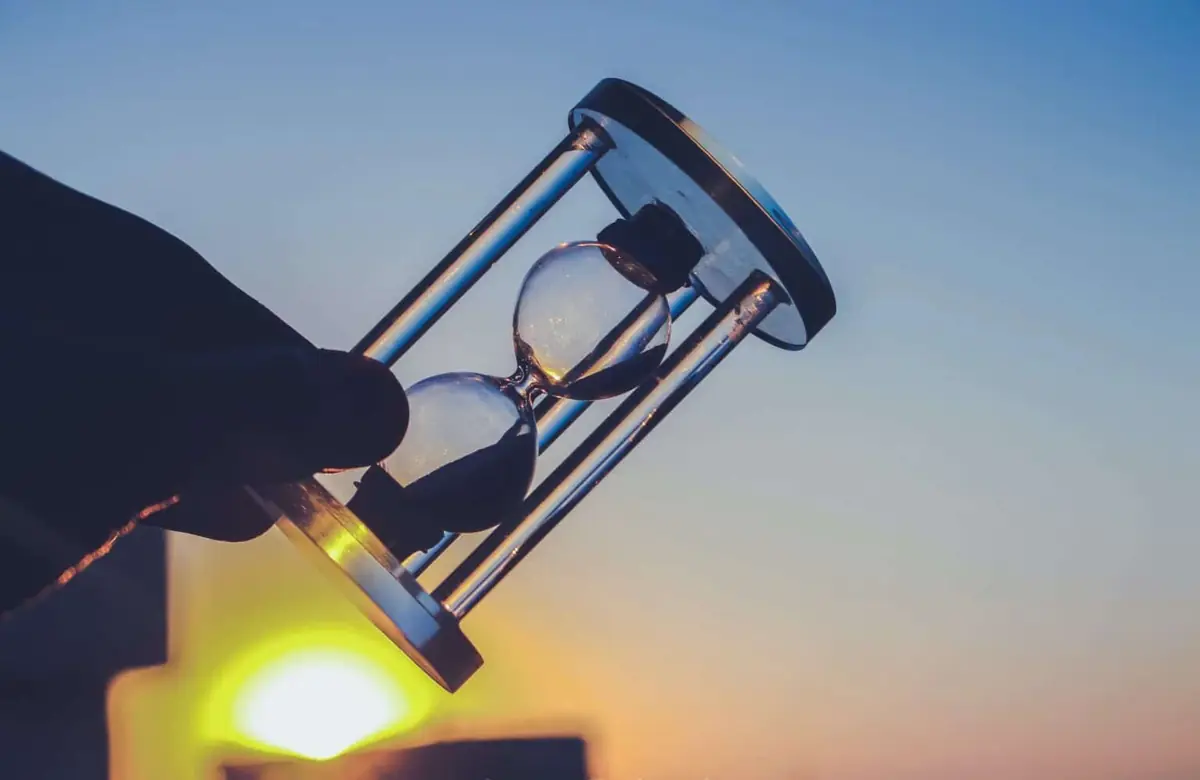 Hourglass in sunlight symbolizing efficient time management.