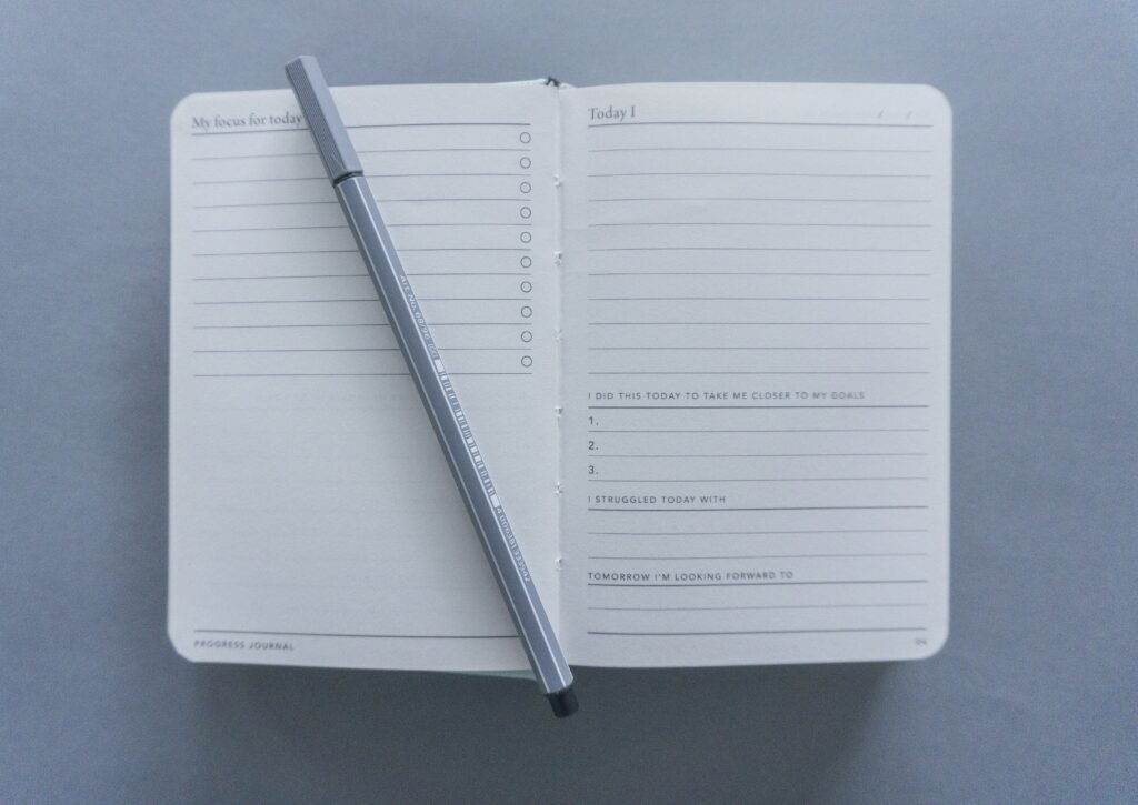 Open notebook with pen for daily journaling or note-taking