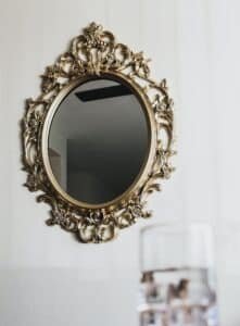 Elegant mirror, white wall