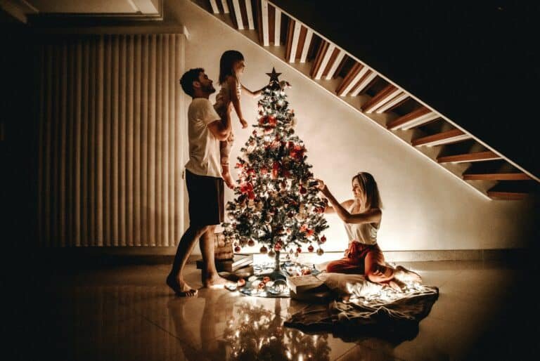 Family putting up a Christmas tree