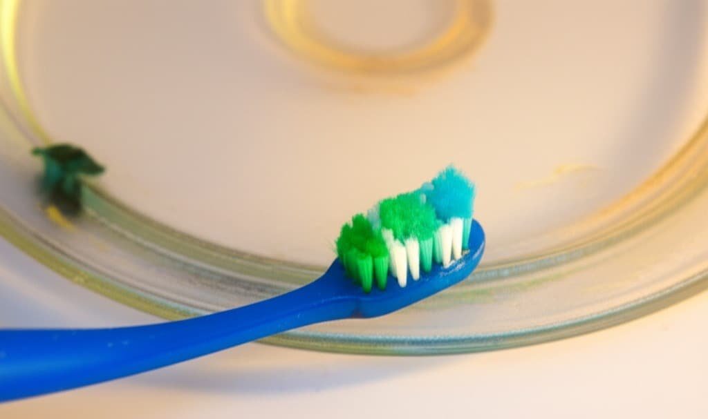 toothbrushes cleaning the microwave ring