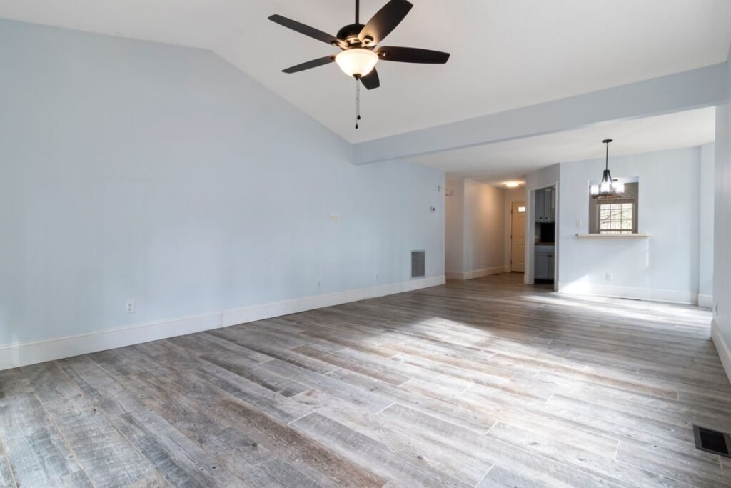 Bright, spotless living room with hardwood floors after a professional cleaning