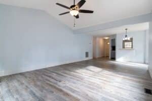 Bright, spotless living room with hardwood floors after a professional cleaning